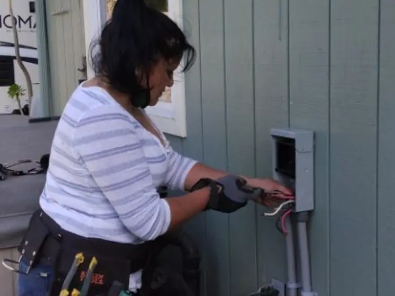 Licensed electrician wiring an exterior subpanel in Broadlands